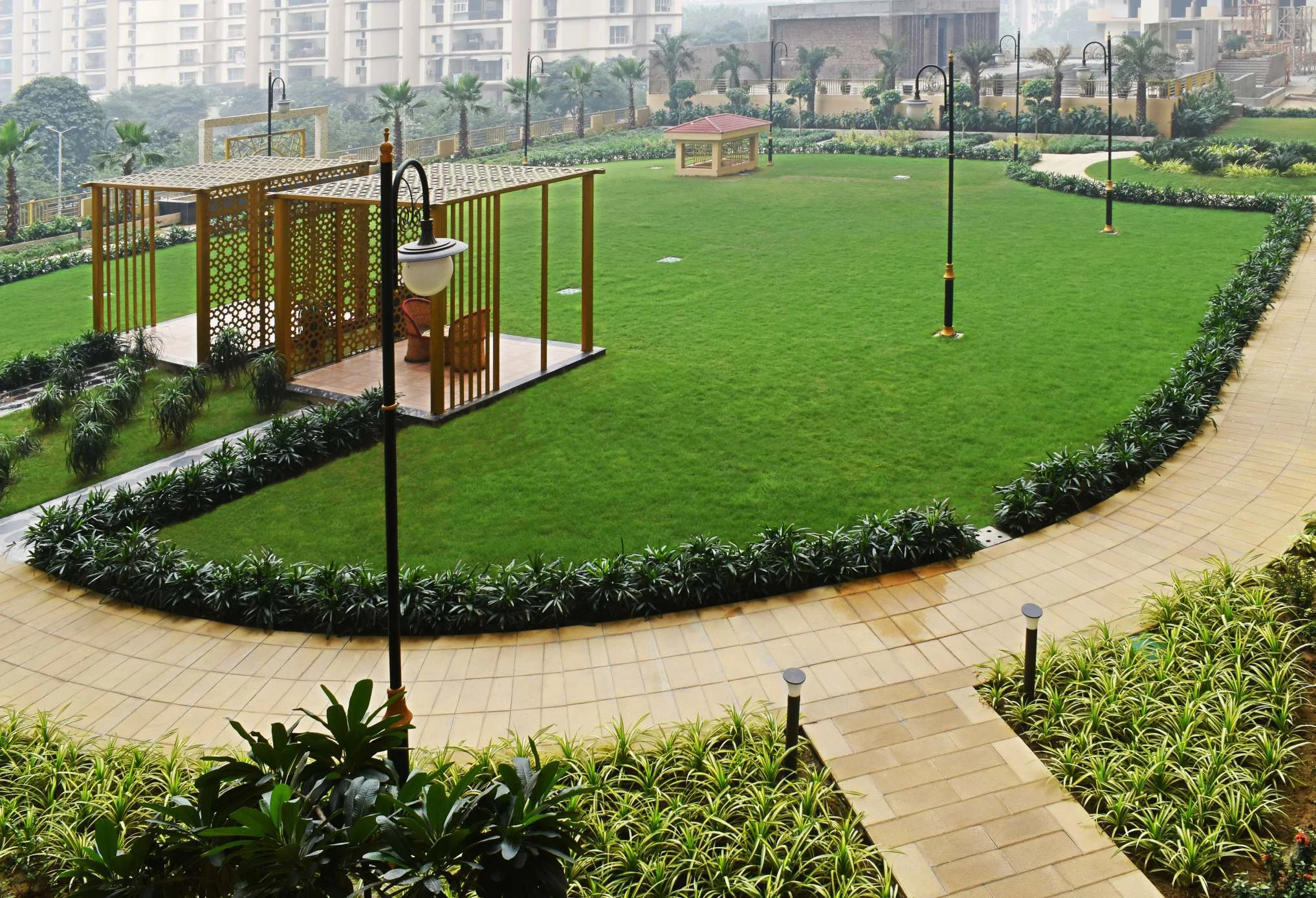 Landscaped garden pictured in the Saya Gold Avenue brochure
